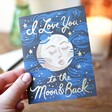 Model Holding I Love You to the Moon & Back Greeting Card