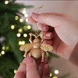 Model Holding Sass & Belle Gold Bee Hanging Decoration