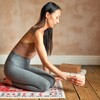 Model Holding Himalayan Rock Salt Candle Holder with Yoga Mat