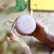 Personalised 50th Birthday Mini Round Travel Jewellery Case held by model over wooden table