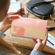 Model Holding Personalised Birth Flower Slim Iridescent Travel Wallet