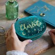 Model Holding Teal Personalised Starry Night Velvet Oval Jewellery Case