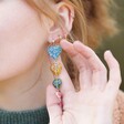 Close Up of Asymmetrical Colourful Heart Bead Drop Earrings on Model