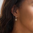 Lisa Angel Crystal Star Huggie Hoop Earrings in Gold on Model