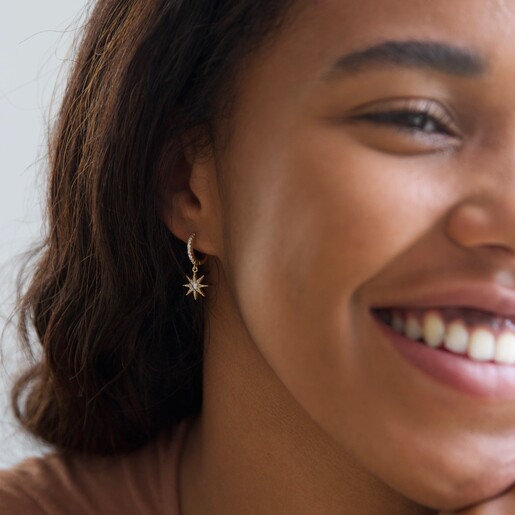 Lisa Angel Model Wearing Crystal Star Huggie Hoop Earrings in Gold