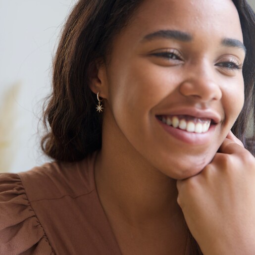 Lisa Angel Ladies' Crystal Star Huggie Hoop Earrings in Gold on Model