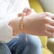 Model Wearing Disc Chain Bracelet in Rose Gold