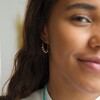 Model Wears Gold Beaded Ball Hoop Earrings