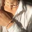 Model Wearing Miyuki Seed Bead and Freshwater Seed Pearl Bracelet and other accessories