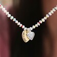 Close Up of Model Holding Personalised Double Heart Miyuki Bead and Freshwater Seed Pearl Necklace
