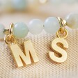 Close up of Personalised Letter Charms Semi-Precious Stone Beaded Necklace in Pastel Green