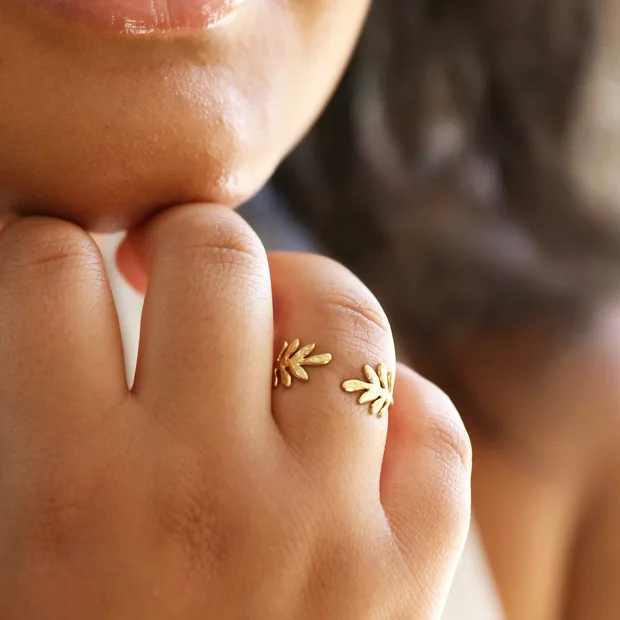 Close up of Adjustable Stainless Steel Fern Leaf Ring in Gold on Model