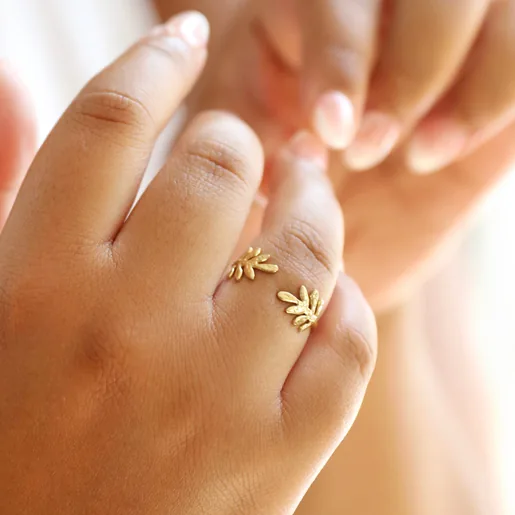 Close up of Model Wearing Adjustable Stainless Steel Fern Leaf Ring in Gold
