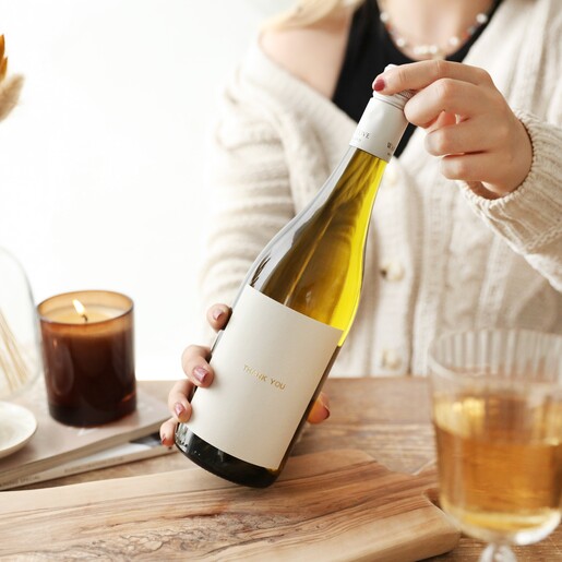 Model Holding Personalised Gold Label Bottle of Rose Wine