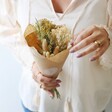 Model Holding Small Natural Dried Flower Posy Bouquet