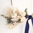 Close up of Slim White & Blue Dried Flower Posy Hoop