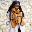 Lisa Angel Personalised Embroidered Check Blanket Scarf in Light Brown Worn by model looking off to the side