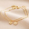 Set of 2 Daisy and Bee Chain Bracelets in Gold on Beige Coloured Fabric