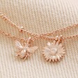 Close Up of Pendants on Set of 2 Daisy and Bee Chain Bracelets in Rose Gold
