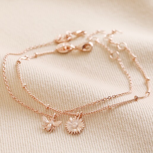 Set of 2 Daisy and Bee Chain Bracelets in Rose Gold on Beige Coloured Fabric