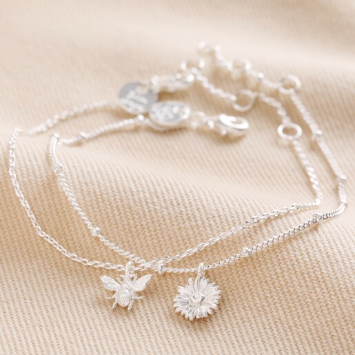 Set of 2 Daisy and Bee Chain Bracelets in Silver on Beige Coloured Fabric