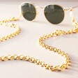Chunky Loop Glasses Chain in Gold on Glasses on Neutral Coloured Surface