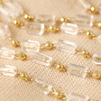 Clear Beaded Glasses Chain in Gold on Neutral Fabric