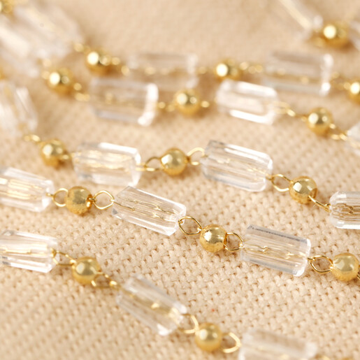 Clear Beaded Glasses Chain in Gold on Neutral Fabric
