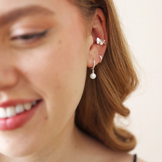 Butterfly Ear Cuff in Silver on Model with Cream Background
