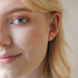 Model Wearing Daisy Stud from Mismatched Daisy and Bee Stud Earrings in Gold