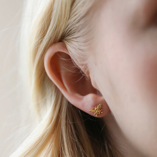Model Wearing Bee Stud from Mismatched Daisy and Bee Stud Earrings in Gold
