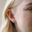 Bee Stud from Mismatched Daisy and Bee Stud Earrings in Rose Gold on Model
