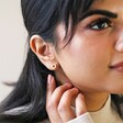 Model Wearing Organic Russian Ring Molten Stud Earrings in Gold with Neutral Background