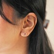 Close Up of Model Wearing Organic Russian Ring Molten Stud Earrings in Rose Gold