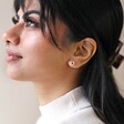 Model Wearing Organic Russian Ring Molten Stud Earrings in Silver Head Turned to Side