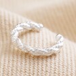 Twisted Rope Ear Cuff in Silver on Cream Fabric Background