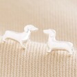 Sausage Dog Stud Earrings in Silver on Beige Coloured Fabric
