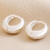 Wide Domed Huggie Hoops in Silver on Natural Coloured Fabric