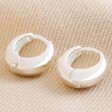 Wide Domed Huggie Hoops in Silver on Natural Coloured Fabric