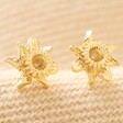 March Daffodil Tiny Birth Flower Stud Earrings in Gold on Neutral Fabric