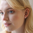 December Narcissus Tiny Birth Flower Stud Earrings in Silver on Model