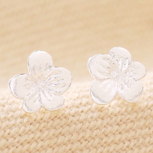 Close Up of February Violet Tiny Birth Flower Stud Earrings in Silver