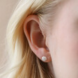 Model Wearing January Carnation Tiny Birth Flower Stud Earrings in Silver