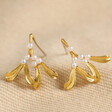 Tiny Pearl Mistletoe Stud Earrings in Gold on Natural Coloured Fabric