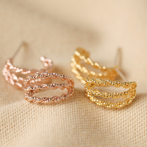 Triple Illusion Rope Hoop Earrings in Rose Gold and Gold on Beige Fabric