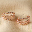 Triple Illusion Rope Hoop Earrings in Rose Gold on Beige Fabric