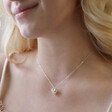 Blonde Model Wearing 3D Molten Heart Pendant Necklace in Silver