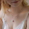 Model Wearing 3D Molten Heart Pendant Necklace in Silver with White Top