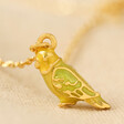 Enamel Canary Bird Pendant Necklace in Gold on Neutral Fabric