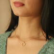 Model Wearing Floral Heart Pendant Necklace in Gold
